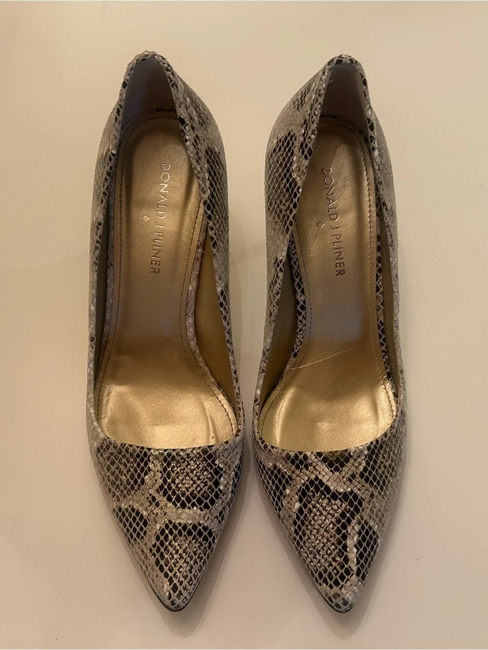 Donald J. Pliner Snake-Print Pointed Toe Pumps in Black and Cream
